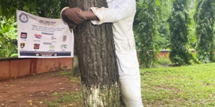 Ghanaian Journalist Breaks Guinness World Record for Tree Hugging